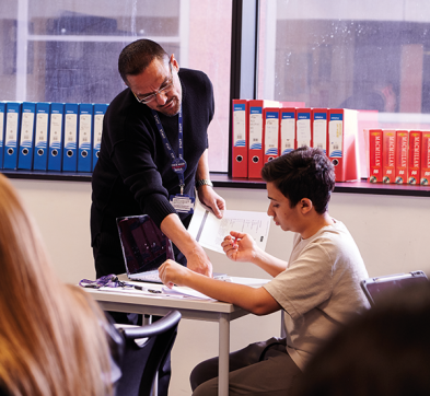 Student and Teacher In GCSE Class At DLD College London